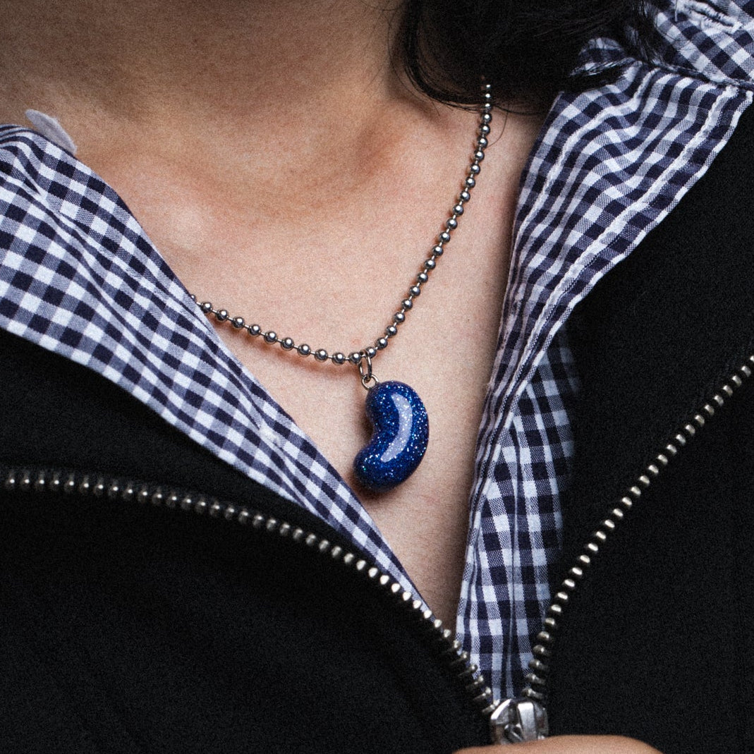 Stardust Bean Pendant with a chain