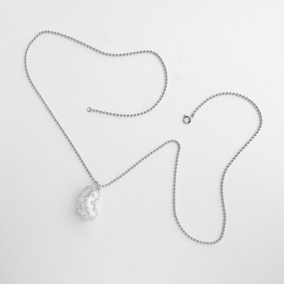 Silver bean pendant with playful pimples. Rhodium plated silver