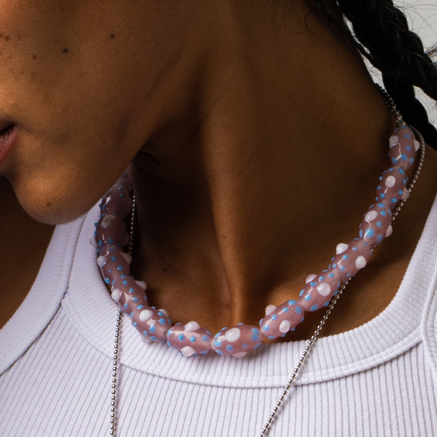 Model wearing beaded choker which is inspired by the beauty of tentacles. Each bead was blown by hand so each bead is unique and might slightly differs from each other.