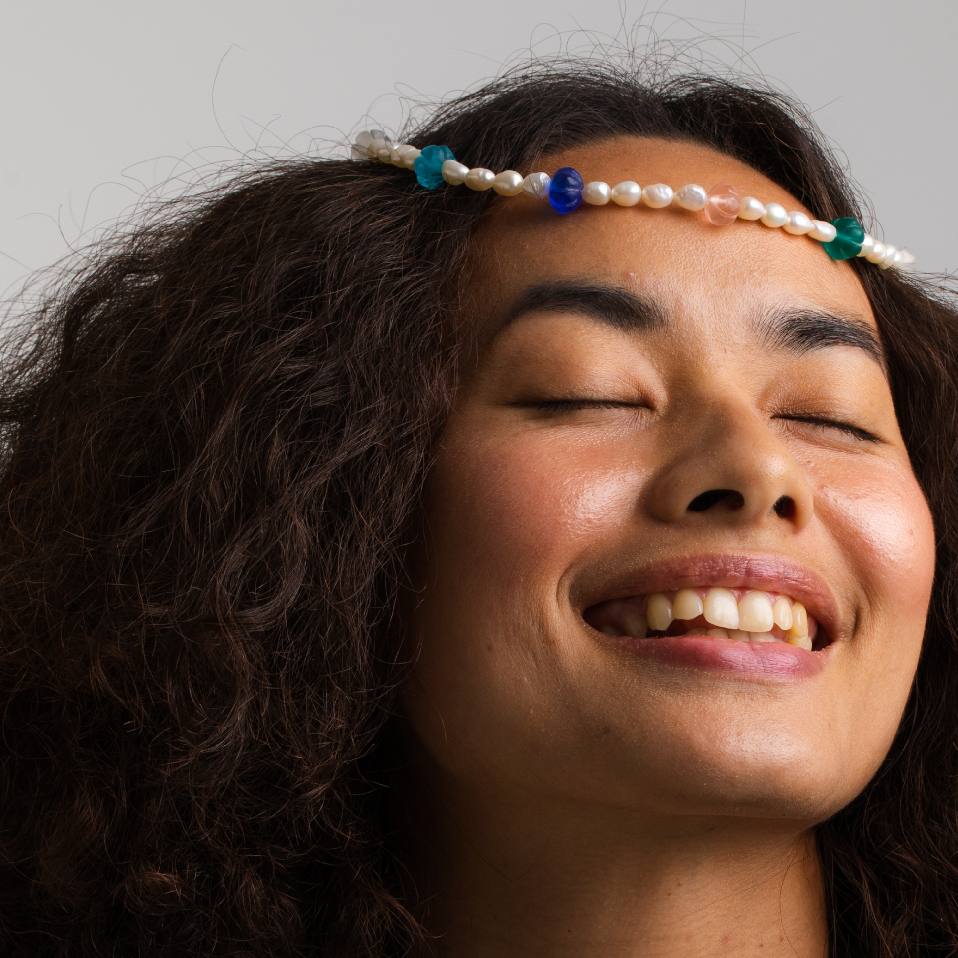 Model wearing Necklace "Recycled Elegance". Made of Old beads, Freshwater pearls and rhodium plated Silver 925.