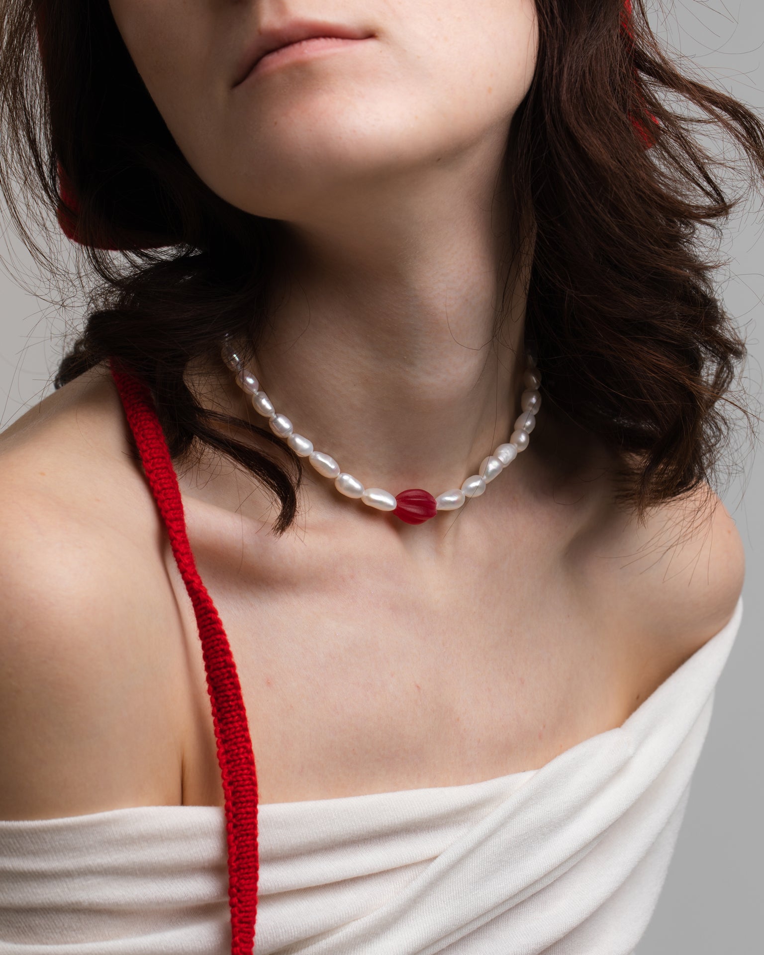 Model wearing Pink bead: a necklace made of Old beads, Freshwater pearls and rhodium plated Silver 925.