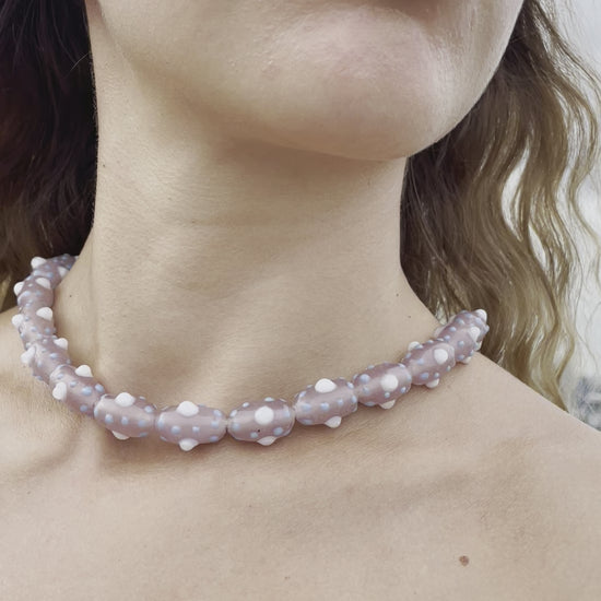 Model wearing beaded choker which is inspired by the beauty of tentacles. Each bead was blown by hand so each bead is unique and might slightly differs from each other.